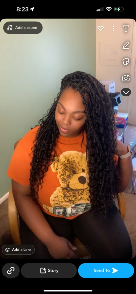 Client looking down to show long black boho braids — Boho Braids