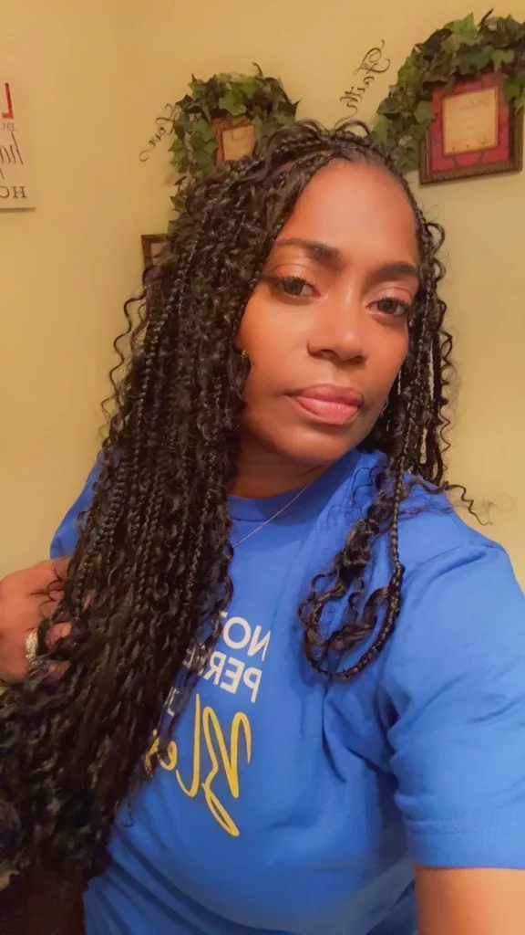 Client wearing long boho braids with loose curled pieces — Boho Braids