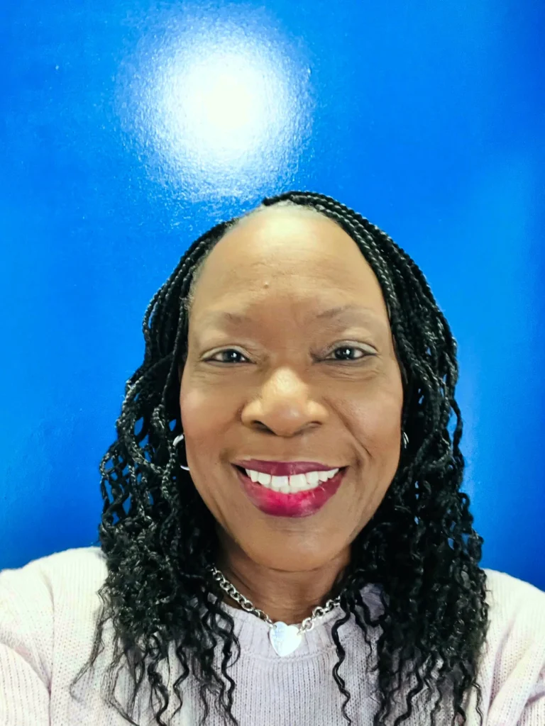 Smiling client with shoulder-length curly box braids — Box Braids