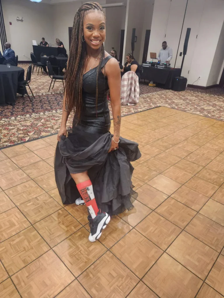 Full-length view of a client wearing long box braids — Box Braids