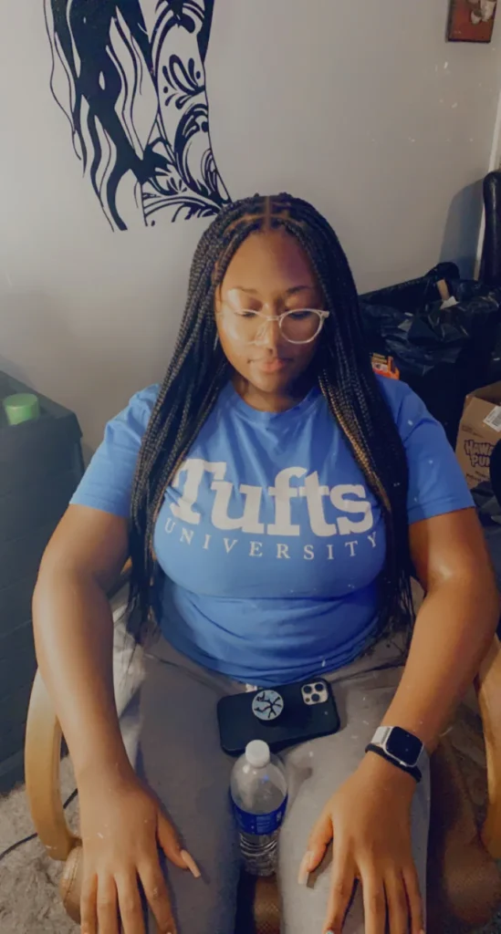 Client looking down to show clean knotless braid parts — Knotless Braids