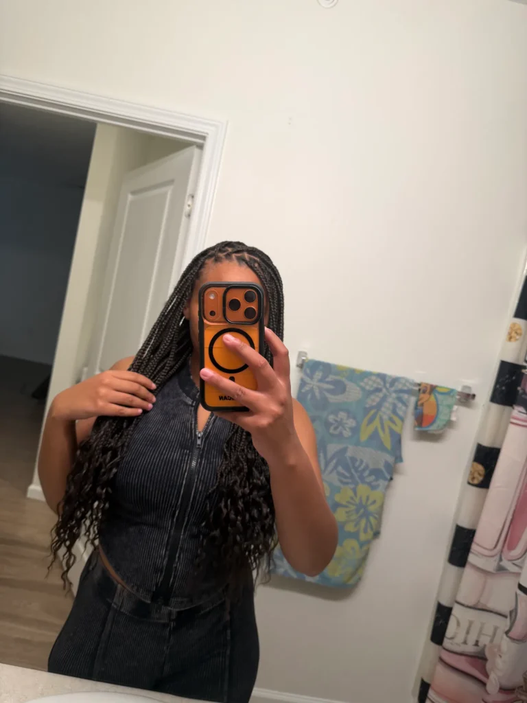 Client using a mirror selfie to show extra-long knotless braids — Knotless Braids